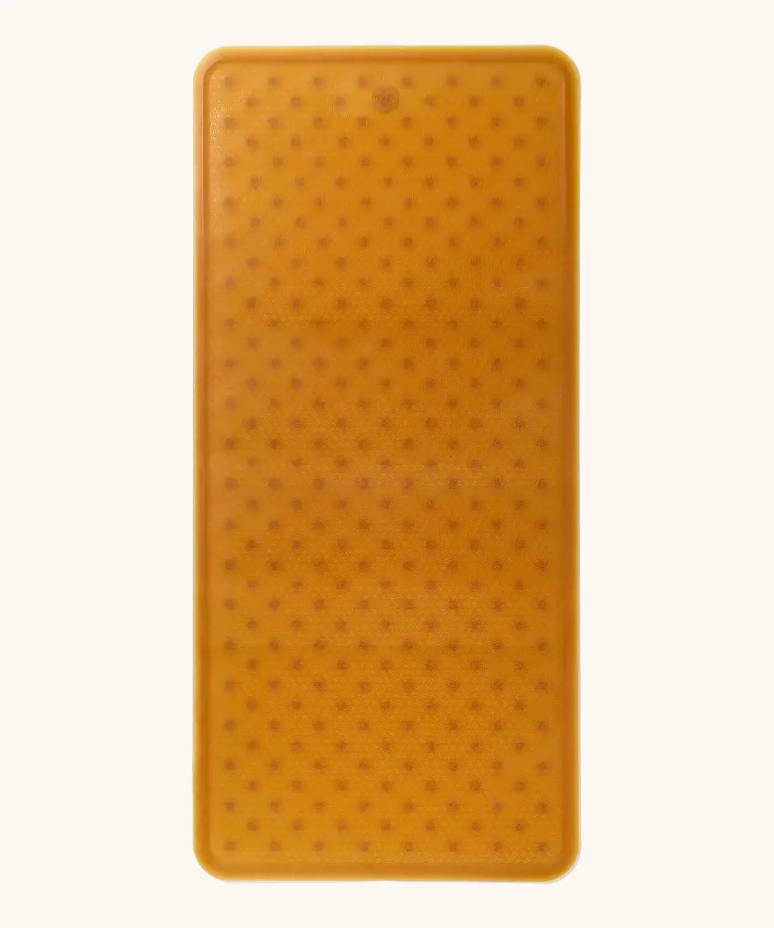 Hevea large natural rubber bath mat in natural orange, with wave pattern for non-slip.