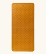 Hevea large natural rubber bath mat in natural orange, with wave pattern for non-slip.