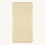 Hevea natural rubber bath mat in the sand colour on a beige background