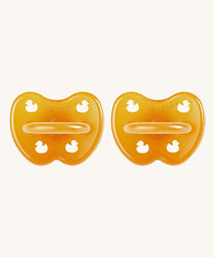 A two-pack of Hevea symmetrical teat baby pacifiers, made from 100% natural rubber and plastic-free. Both in natural orange