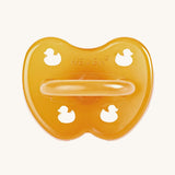The Hevea natural rubber pacifier dummy with a symmetrical nipple shape, in a natural orange colour