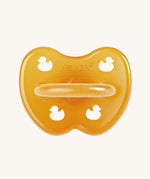 The Hevea natural rubber pacifier dummy with a symmetrical nipple shape, in a natural orange colour