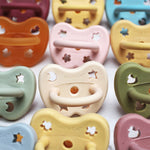 Close up of natural rubber Hevea dummies lined up on a white background