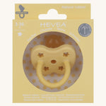 The Hevea 100% natural rubber baby pacifier with an orthodontic teat in its eco friendly box - banana yellow