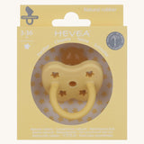 The Hevea 100% natural rubber baby pacifier with an orthodontic teat in its eco friendly box - banana yellow