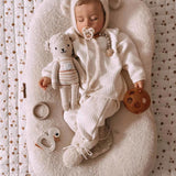 A sleeping baby with a Hevea natural rubber pacifier dummy from Hevea