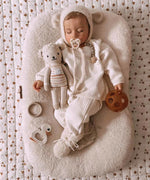 A sleeping baby with a Hevea natural rubber pacifier dummy from Hevea