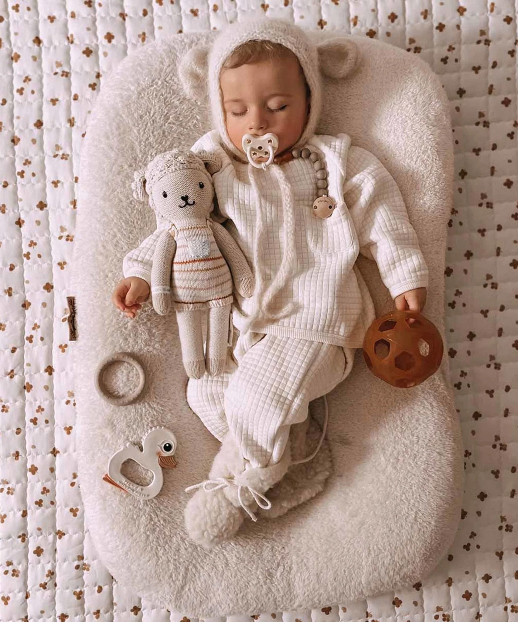 A sleeping baby with a Hevea natural rubber pacifier dummy from Hevea