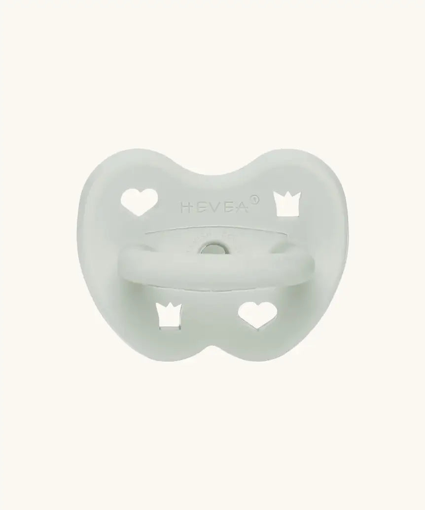 The Hevea natural rubber pacifier dummy in soft pebble green with a symmetrical nipple shape.