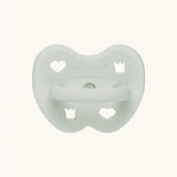 The Hevea natural rubber pacifier dummy in soft pebble green with a symmetrical nipple shape.