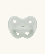 The Hevea natural rubber pacifier dummy in soft pebble green with a symmetrical nipple shape.