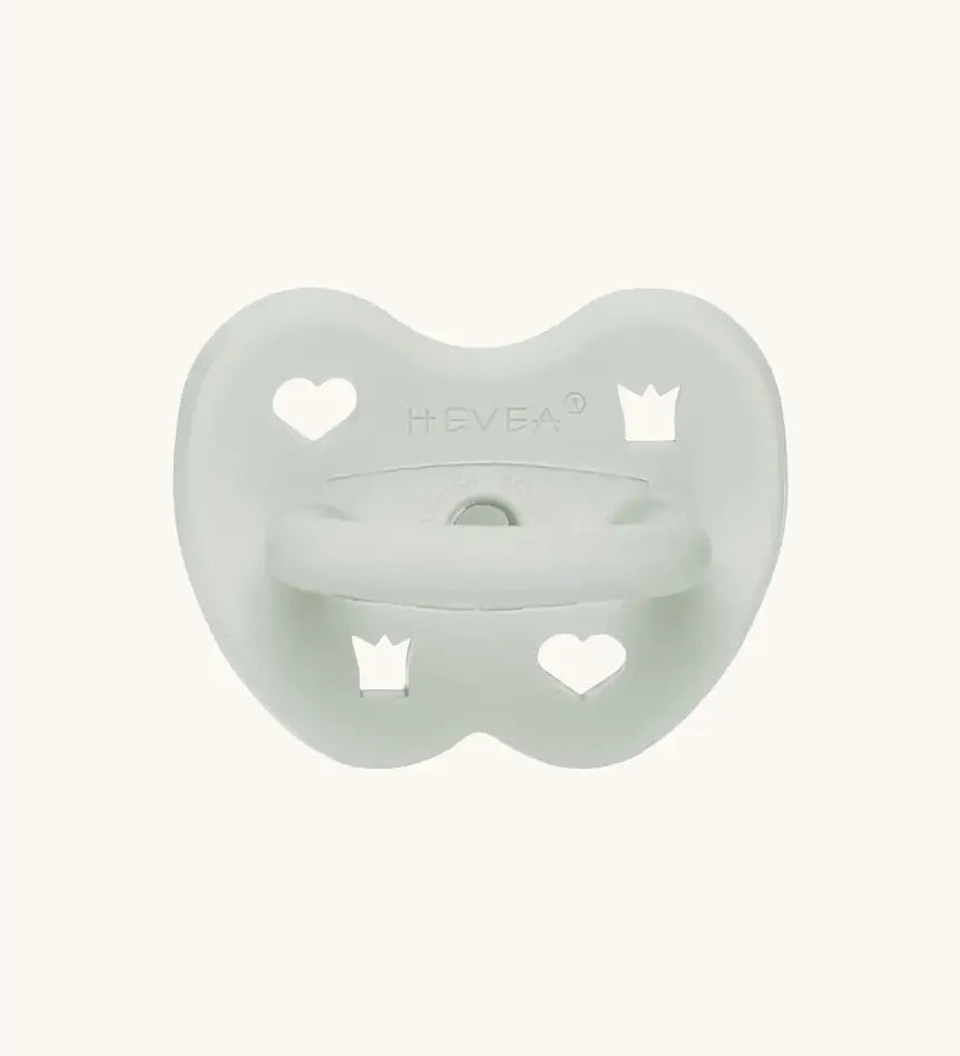The Hevea natural rubber pacifier dummy in soft pebble green with a symmetrical nipple shape.