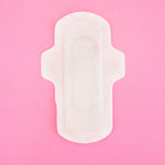 Hey Girls Natural Bamboo & Corn Fibre Disposable Day Pads open on a pink background