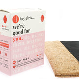 Close up of the pink box for the Hey Girls regular day period pads on a white background