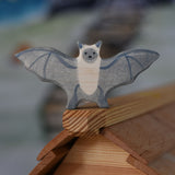 A Holztiger wooden bat toy figure placed on ridge of the Ostheimer cottage roof.
This wooden toy figure is part of a wide range of Holztiger figures and scenery perfect for small world play available here at Babipur 