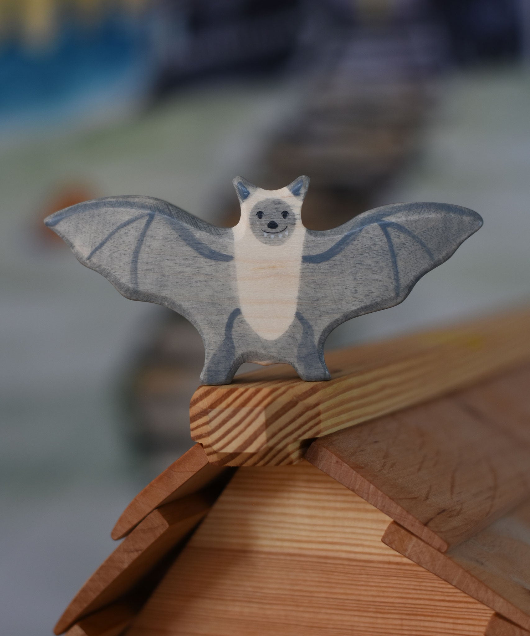 A Holztiger wooden bat toy figure placed on ridge of the Ostheimer cottage roof.
This wooden toy figure is part of a wide range of Holztiger figures and scenery perfect for small world play available here at Babipur 