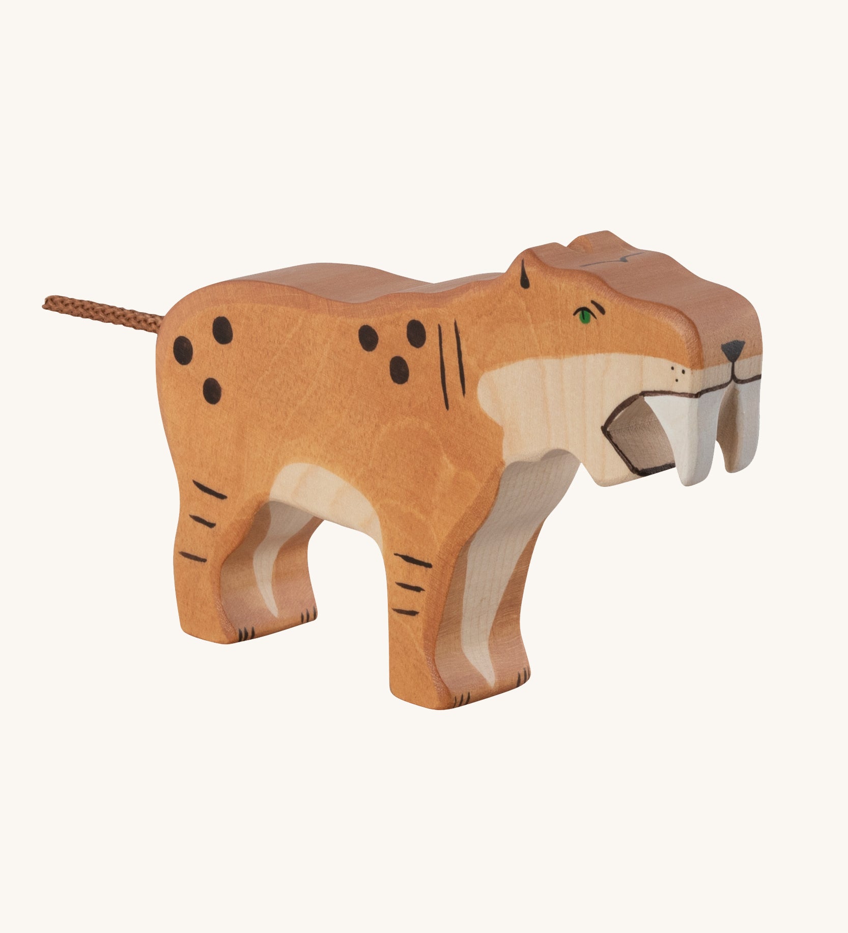The Holztiger Saber-Toothed Tiger wooden animal toy. A hand carved and painted toy for encouraging imaginative and Waldorf-inspired play. 