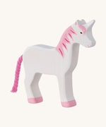 The Holztiger Unicorn wooden animal toy. A hand carved and painted toy for encouraging imaginative and Waldorf-inspired play. 