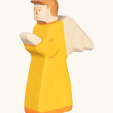 Holztiger handcrafted wooden angel figure with orange gown and brown hair