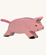 Holztiger Running Piglet Toy on a plain background. 