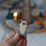 A Holztiger wooden bat toy figure held in an adult's hand to show scale.
This wooden toy figure is part of a wide range of Holztiger figures and scenery perfect for small world play available here at Babipur 