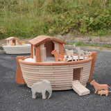 Holztiger handcrafted wooden XL Noah's ark with different animals on top  and side ramp down. Smaller ark in the background