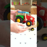 The Bajo wooden tractor and Trailer toy