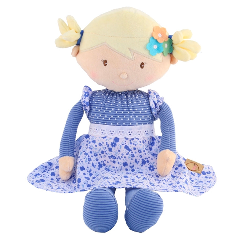 The Bonikka Skye rag doll is a soft toy doll with light brown fleece hair in pig tails and a deep pink spotty and floral dress. sat down with white background.