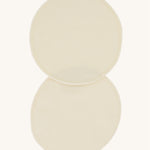 A pair of Imse Merino Wool Breast Warmer Pads pictured on a plain background