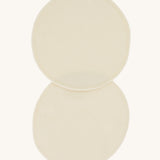 A pair of Imse Merino Wool Breast Warmer Pads pictured on a plain background