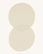 A pair of Imse Merino Wool Breast Warmer Pads pictured on a plain background