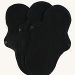 Imse Vimse black coloured Active Regular reusable Period Pads pictured on a plain background