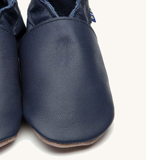 A close up of the Inch Blue plain navy shoes available at Babipur. 
