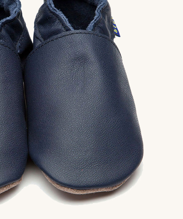 A close up of the Inch Blue plain navy shoes available at Babipur. 