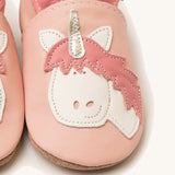A close up of the Inch Blue pink unicorn baby shoes available at Babipur showing the white and pink unicorn cutout design