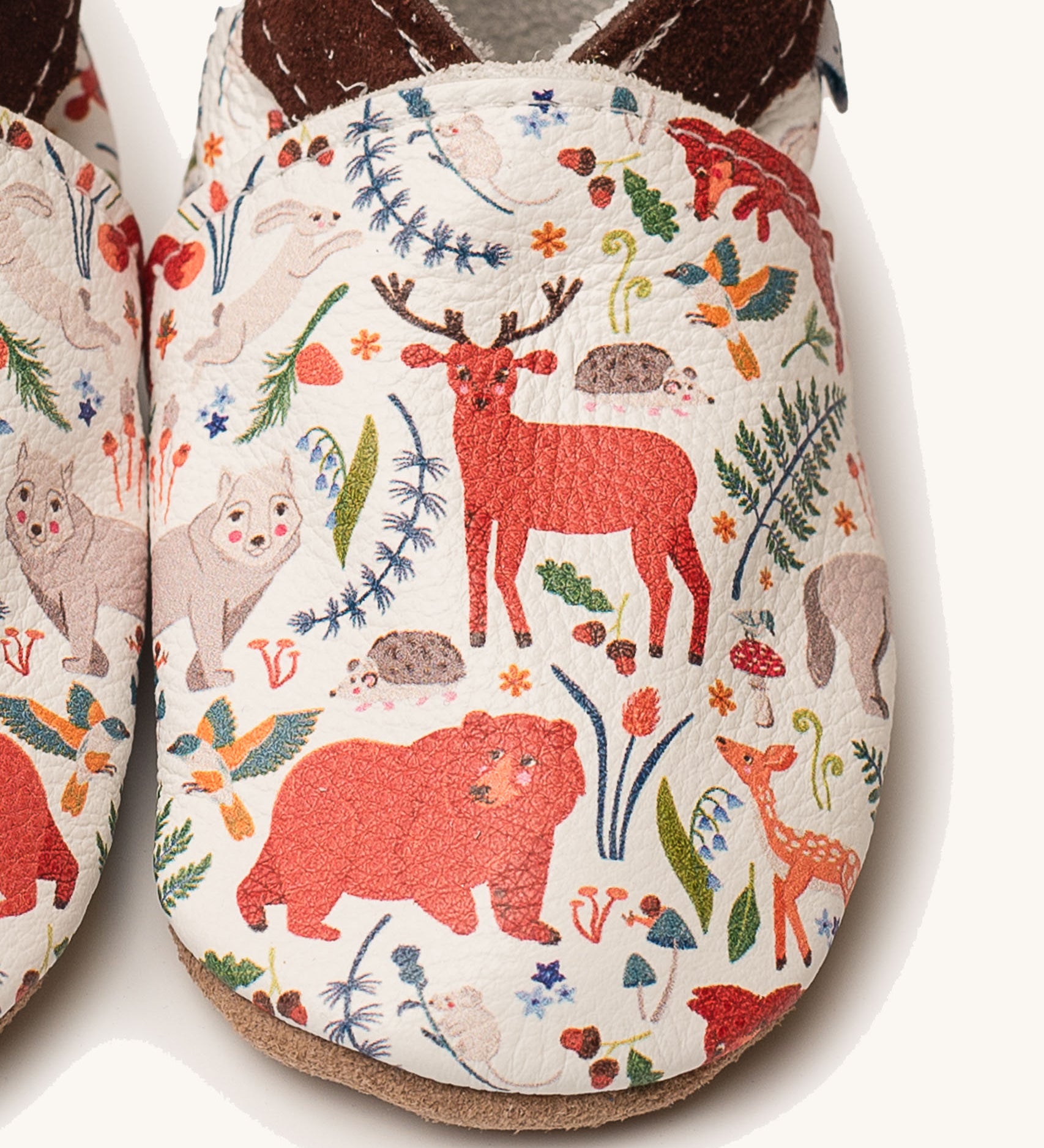 A close up of the Inch Blue stag & friends shoes available at Babipur showing a closer look at the stag and friends design