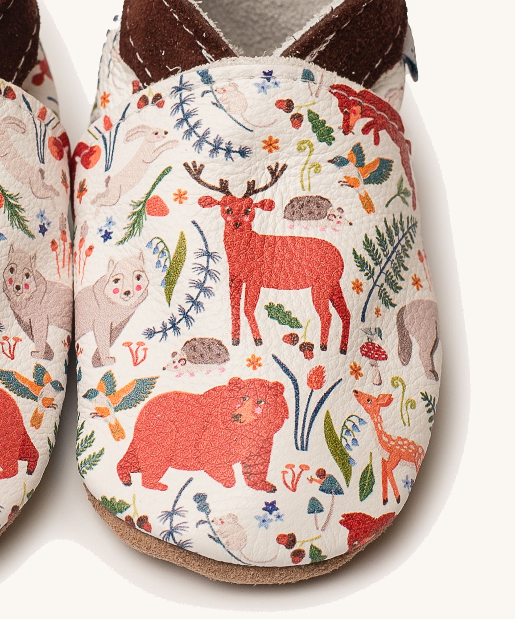 A close up of the Inch Blue stag & friends shoes available at Babipur showing a closer look at the stag and friends design