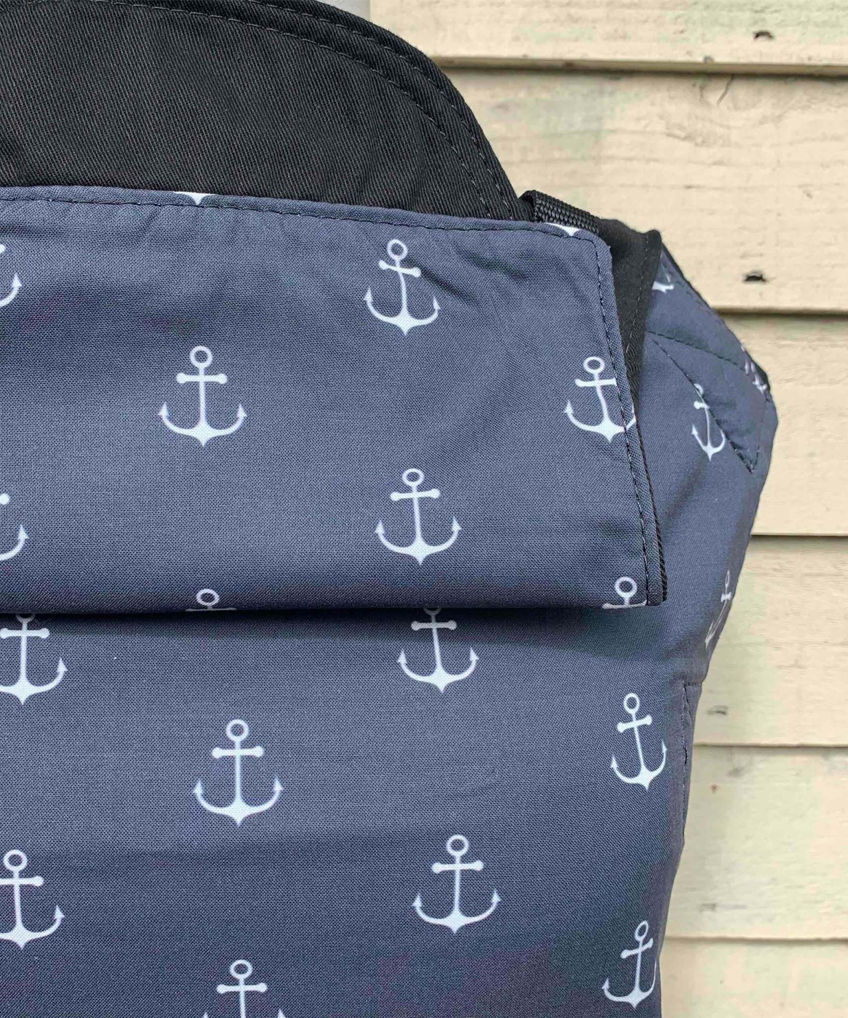 A close up of the anchor design an hood detail from the integra navy anchor baby carrier available at Babipur.