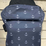 Integra anchor carrier available at a Babipur a navy coloured carrier with a all over anchor print. Features a small hood for head protection.