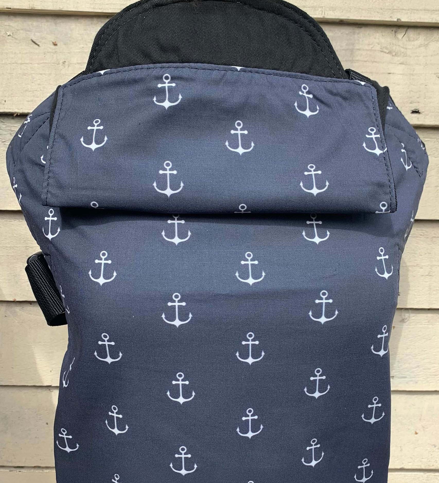 Integra anchor carrier available at a Babipur a navy coloured carrier with a all over anchor print. Features a small hood for head protection.
