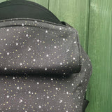 A close up of the all over star design and hood detail on the Integra believe baby carrier available at Babipur.