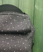 A close up of the all over star design and hood detail on the Integra believe baby carrier available at Babipur.