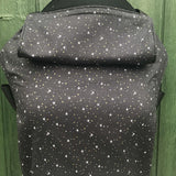 Integra believe design baby carrier available at a Babipur.  A grey carrier with a all over star design. Features a small hood for head protection.