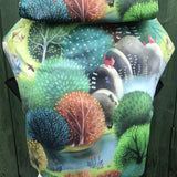 Integra forest glade baby carrier available at a Babipur a sketch style design of a forest with various animals. Features a small hood for head protection.