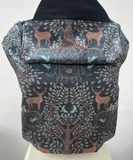 Integra forest tree carrier available at a Babipur a dark coloured carrier with a beautiful reindeer in a forest design. Features a small hood for head protection.
