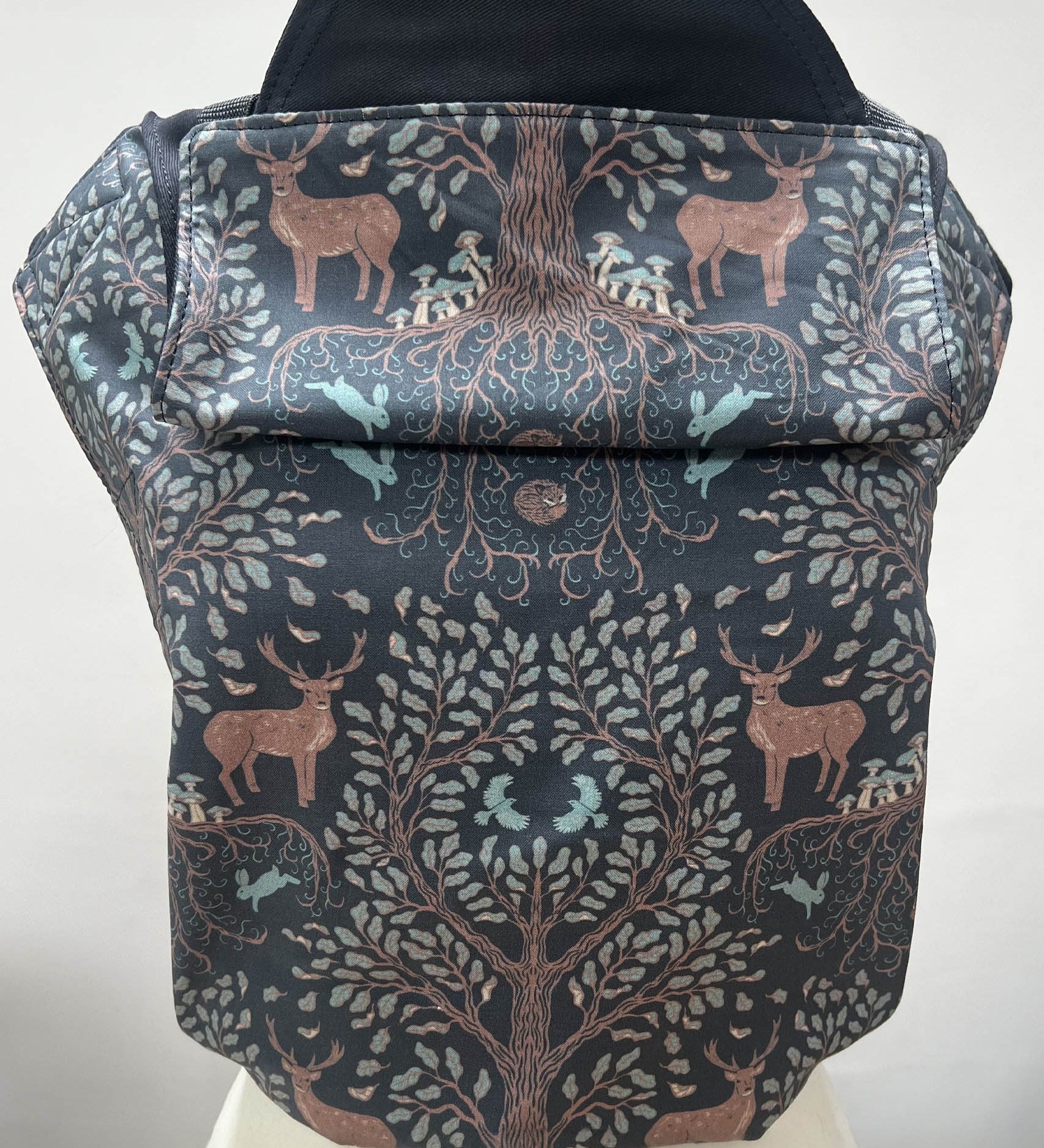 Integra forest tree carrier available at a Babipur a dark coloured carrier with a beautiful reindeer in a forest design. Features a small hood for head protection.