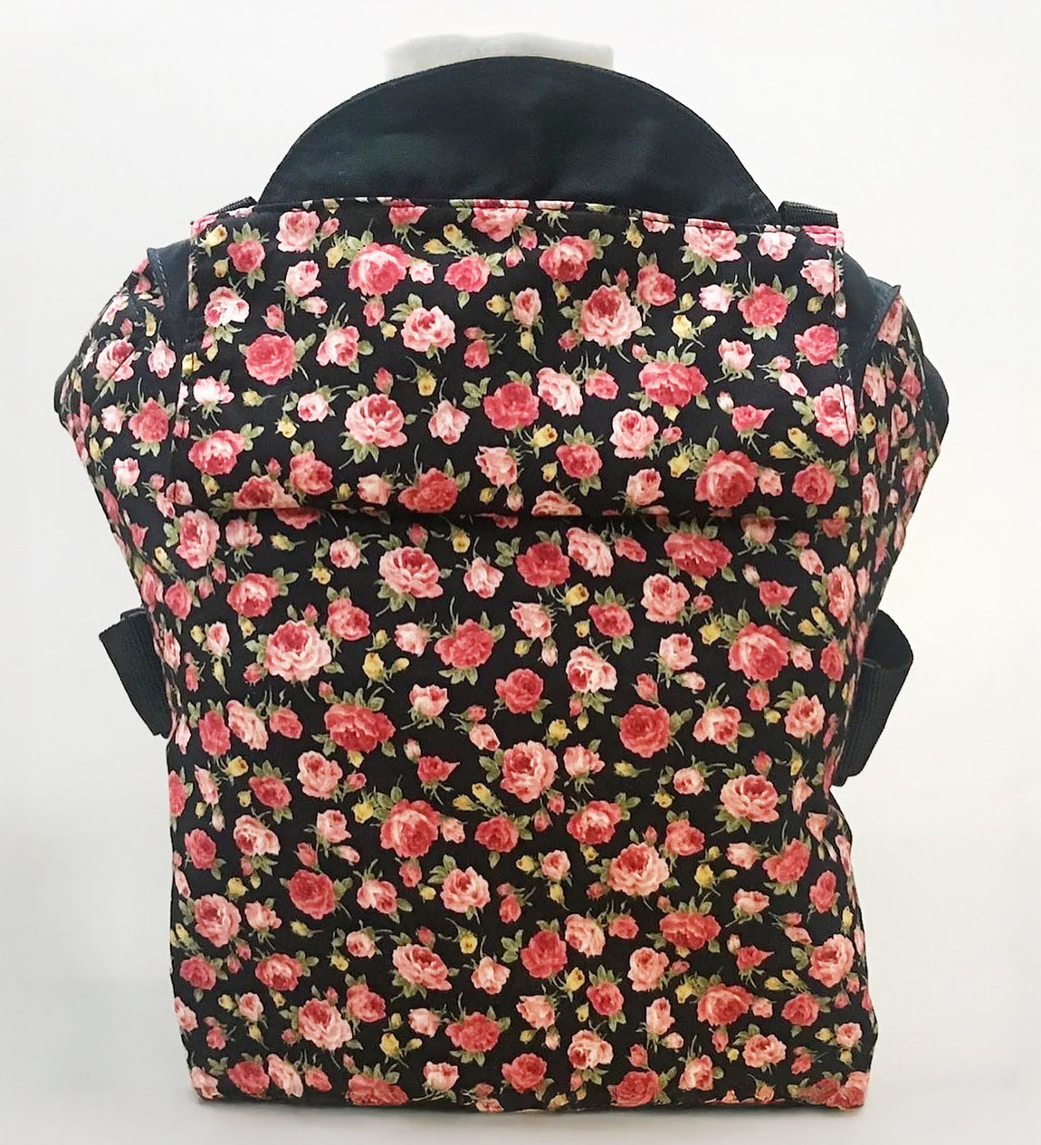 Integra Gallica rose carrier available at a Babipur a dark coloured carrier with a vintage rose design. Features a small hood for head protection.