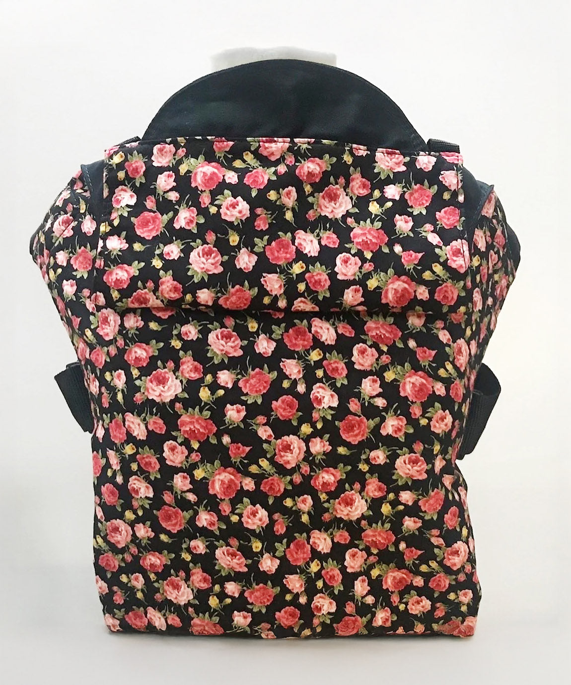 Integra Gallica rose carrier available at a Babipur a dark coloured carrier with a vintage rose design. Features a small hood for head protection.