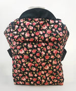 Integra Gallica rose carrier available at a Babipur a dark coloured carrier with a vintage rose design. Features a small hood for head protection.