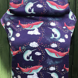 Integra ocean slumber baby carrier available at a Babipur a dark coloured carrier with playful sleeping whales design. Features a small hood for head protection